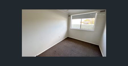 Comfortable Two-Bedroom Unit in a Central Location - Photo 2