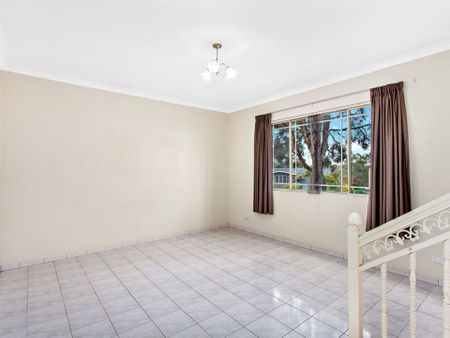 Spacious Four-Bedroom Home with Private Yard & Versatile Living - Photo 4
