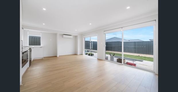 Coastal Living at It's Finest! Brand New Dual Key Home with Lawn Mowing Included! - Photo 1