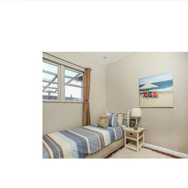 "Close to schools, transport, not on main street" - Photo 1