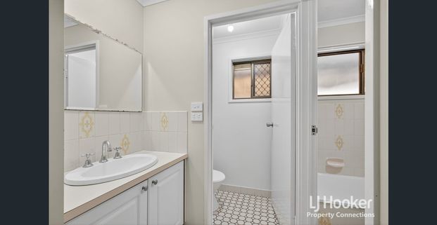 Low Set Brick Home Offering Comfort, Convenience and Charm - Photo 1