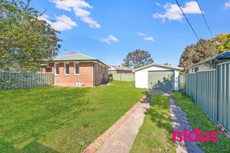 “Neat & Spacious 3-Bedroom Home with Ample Parking on a Generous Block” - Photo 5