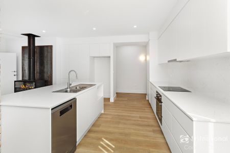 Meticulously Renovated 4-Bedroom Home - Photo 2