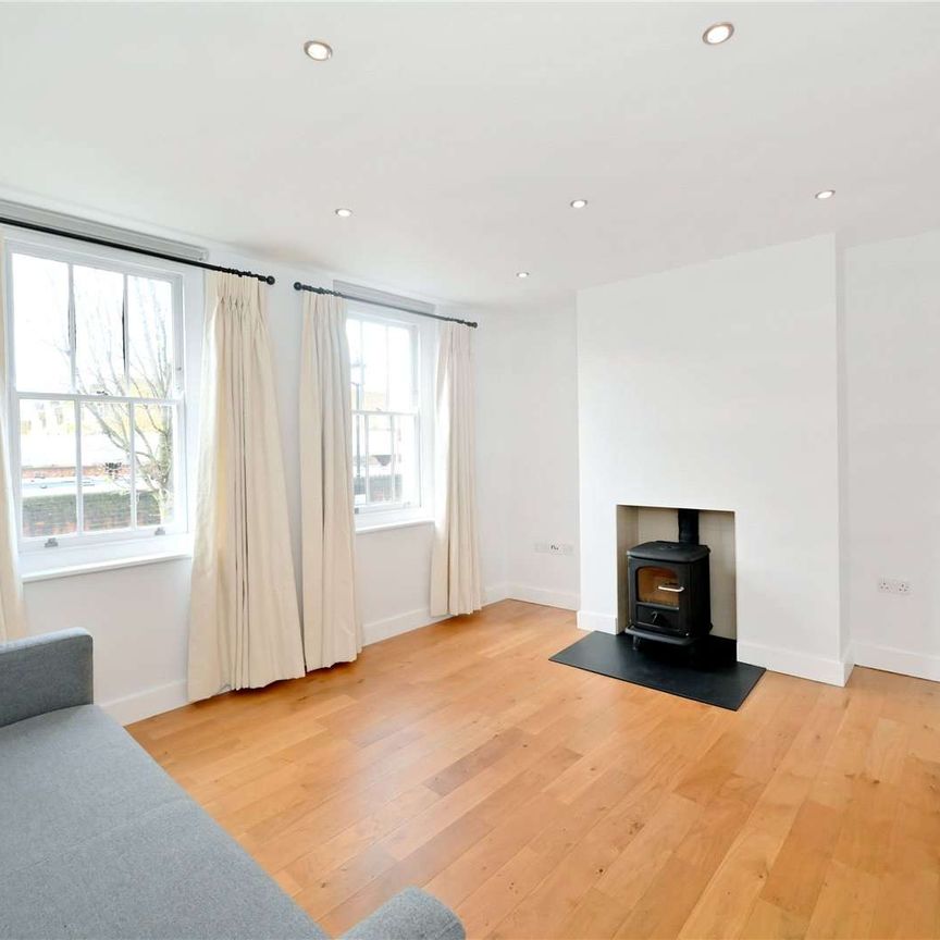 Charming two bedroom terraced house with private outdoor space - Photo 1