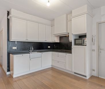 Gelijkvloers appartement met 1 à 2 slaapkamers, tuintje en garagebox - Photo 1