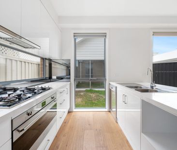 Stylish, Spacious Living with Modern Comfort Across Two Levels - Photo 5