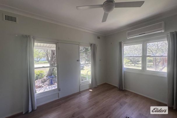 Rural home in the heart of town - Photo 1