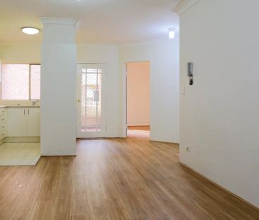 “1ST FLOOR UNIT - WALK TO STATION” - Photo 1