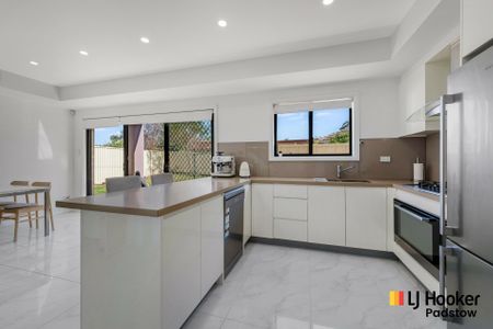 Stylish Four-Bedroom Home in a Prime Location - Photo 5