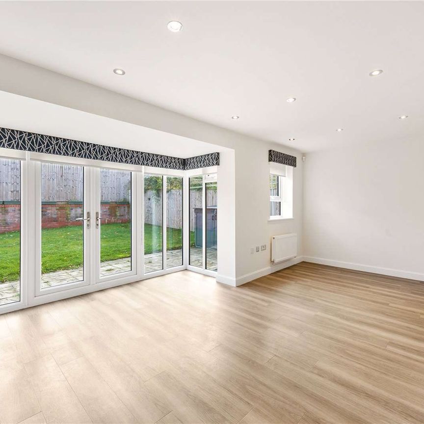 Stylish, modern family home in Wilmslow, with garage and enclosed garden - Photo 1