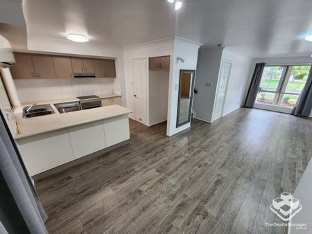 Double Garage, Air-Conditioned and wooden flooring throughout! - Photo 2
