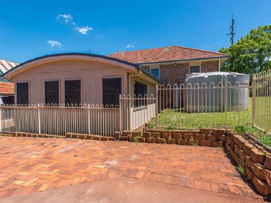 The Whole Package! Spacious 5-Bedroom Home + Sheds Galore! - Photo 1