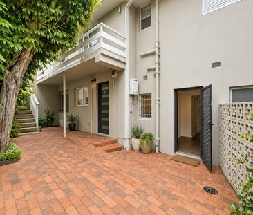 Unfurnished Downstairs One-Bedroom Apartment in Ultra-Convenient Lo... - Photo 4