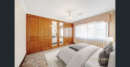 Stylish 4-Bedroom Home with Huge Garage and Family-Friendly Backyard - Photo 5