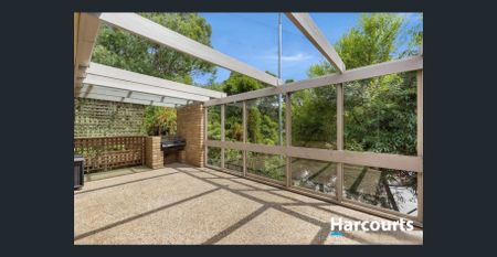 Elegant Brick Home with Serene Garden Surrounds - Photo 3