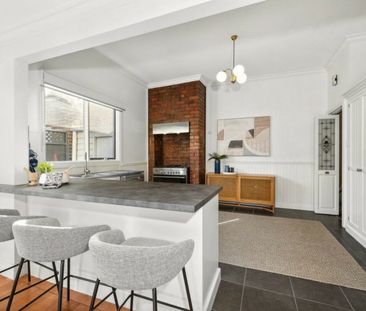 Stylish Living Behind a Charming Exterior - Photo 2