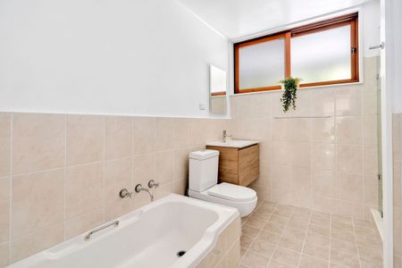 LIGHT-FILLED FAMILY RETREAT OFFERING SPACE AND CONVENIENCE - Photo 5