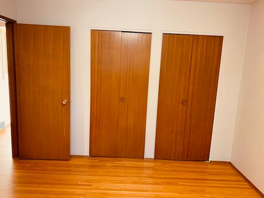 Bright 2 Bed Home Near U Of C | Garage + Laundry - Photo 1