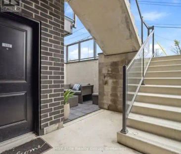 111 - 6065 MCLEOD ROAD — 1 Bedroom - Photo 1