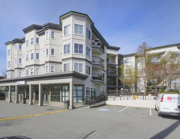 Two Bed, Two Bath Corner Unit Condo in Langley with Mountain Views and Two Parking Spaces - Photo 1