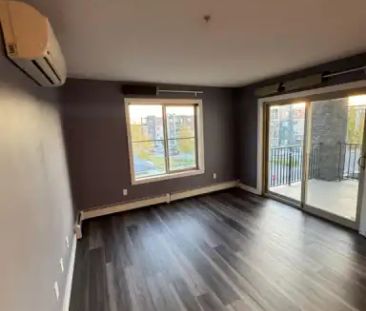 A spacious 2-bedroom, 2-bathroom unit in a highly sought-after comm... - Photo 1