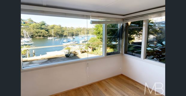 TRANQUIL WATERFRONT RETREAT WITH CAPTIVATING BAY VIEWS - Photo 1