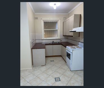Tidy 3 Bedroom Home with Enclosed Yard - Photo 3