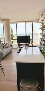 Elegant 2 Bed, 2 Bath Corner Suite with Waterfront Views and Patio - Photo 3