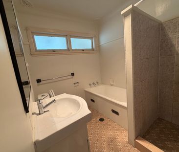 Refreshed three-bedroom home in prime location - Photo 5