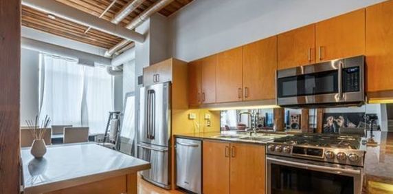 OVERSIZED ONE BDRM WITH HIGH CEILINGS IN THE CANDY FACTORY LOFTS! - Photo 2