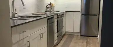Bright, beautiful freshly renovated, 1 bedroom basement suite | Brockington Rd NW 5003, Calgary - Photo 1