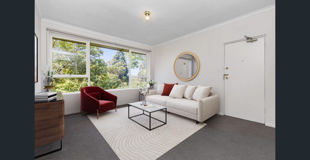 Stylish Two-Bedroom Gem with Secure Parking in a Winning Location! - Photo 1