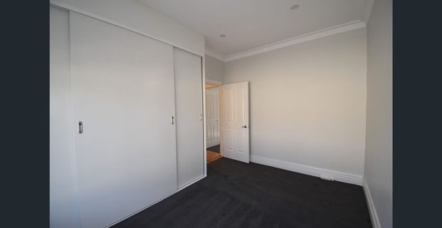 Sunlit Luxe Townhouse with Private Gardens & Premium Upgrades (Professional Garden Maintenance Included) - Photo 1