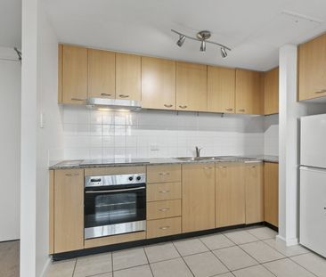 Dual-Level "Loft-Style" Apartment in Convenient Locale with Parking - Photo 6