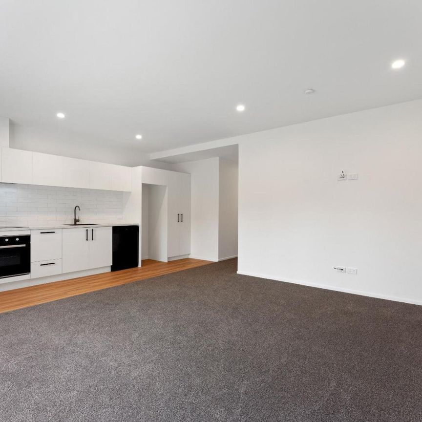 Enjoy modern living in a brand new unit - Photo 1