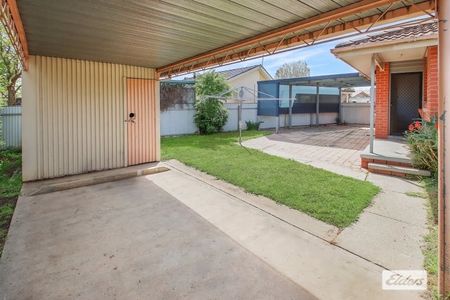 Charming 3-Bedroom Home with Modern Comforts & Outdoor Storage - Photo 2