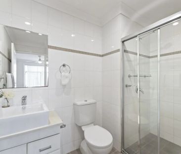 Light Filled Apartment with Oversized Lockup Garage - Photo 1