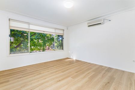 Charming Family Home with Spacious Layout & Low-Maintenance Yard - Photo 4