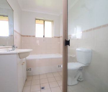 Spacious Top-Floor Two-Bedroom Unit in a Convenient Location - Photo 5