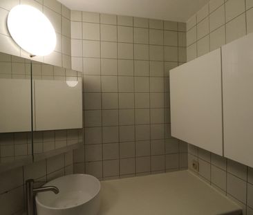 Een gerenoveerd appartement op de eerste verdieping achteraan met a... - Photo 2