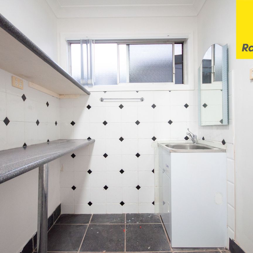 FRESHLY UPDATED FOUR-BEDROOM FAMILY HOME IN A CONVENIENT LOCATION - Photo 1