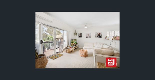 Stylish & Spacious 2-Bedroom Unit in a Prime Coastal Location - Photo 1