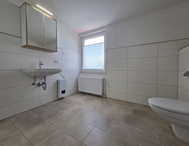 Traumhafte Obergeschosswohnung – modern, lichtdurchflutet und nur wenige Minuten vom Meer entfernt - Foto 1