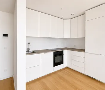 Moderne 2-Zimmer-Neubauwohnung mit Loggia & Parkblick am Laaer Wald - Foto 2