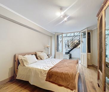 Gelijkvloerse verdieping met één slaapkamer in Saint-Gilles - Photo 4
