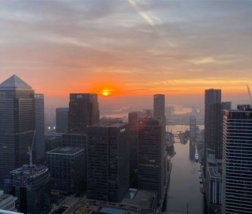 This exquisite apartment boasts breath-taking views of the River Thames from floor-to-ceiling windows. It comprises a spacious open-plan reception, kitchen, and living area. - Photo 1