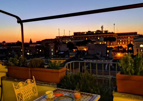 Attic-Monti: 1-6 month rentals. Spacious, furnished 3 Bedroom, 2 bath, living room, dining room, study and large panoramic terrace. Bright, silent, located in well kept Palazzo d’Epoca with elevator and doorman. Near transport and Metro.