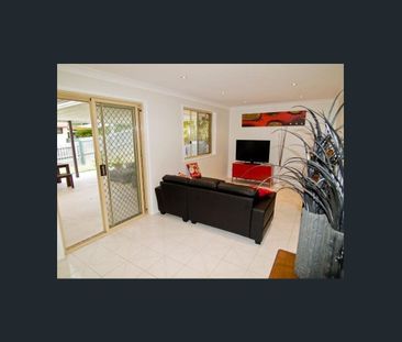 Lowset brick home with large pergola - Photo 1