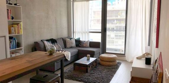 Stylish 1 Bed, 1 Bath with City Views and High Ceilings plus Balcony - Photo 2