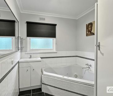 A beautifully renovated four-bedroom home - Photo 6